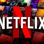 Netflix logo, movies and shows posters in background