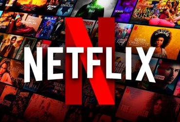 Netflix logo, movies and shows posters in background